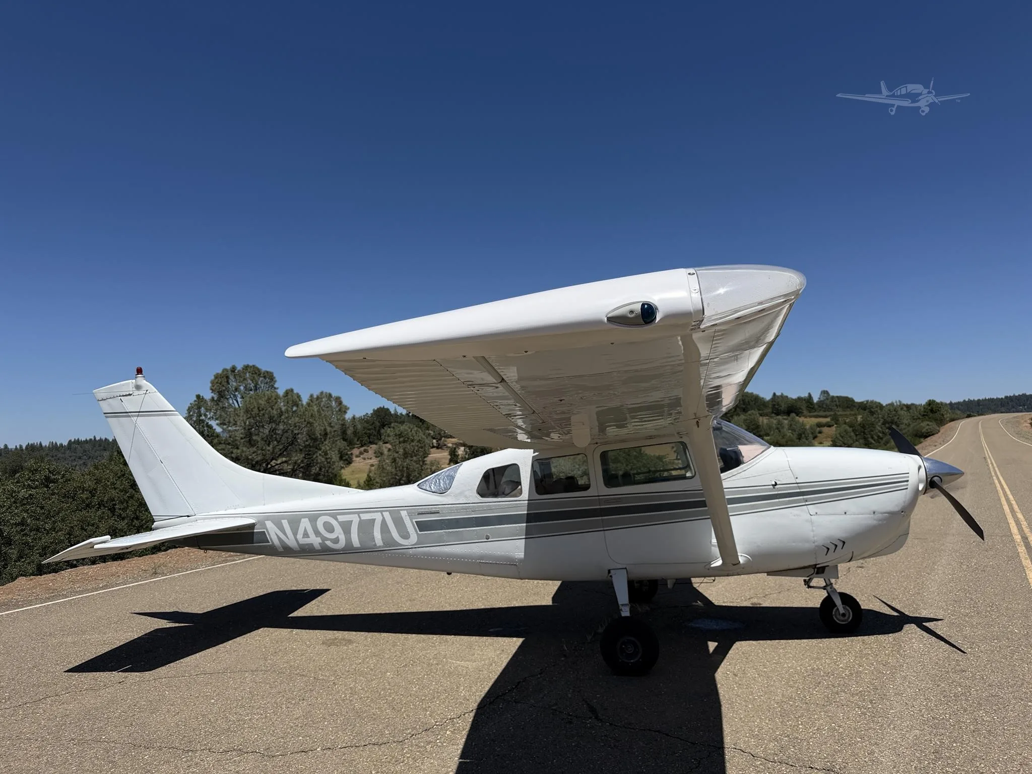 Exterior view of a 1965 CESSNA 210, N4977U.