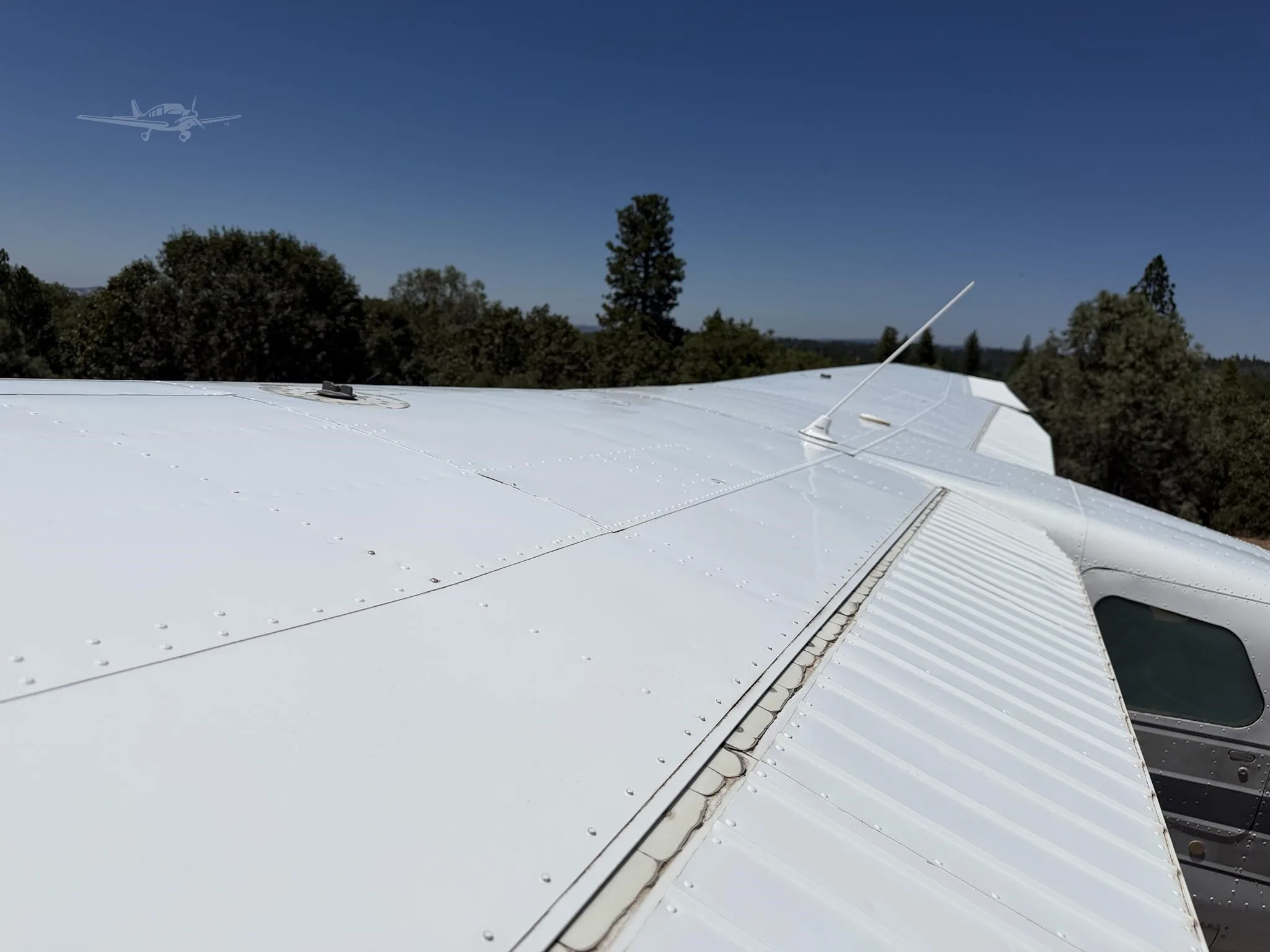 Exterior view of a 1965 CESSNA 210, N4977U.