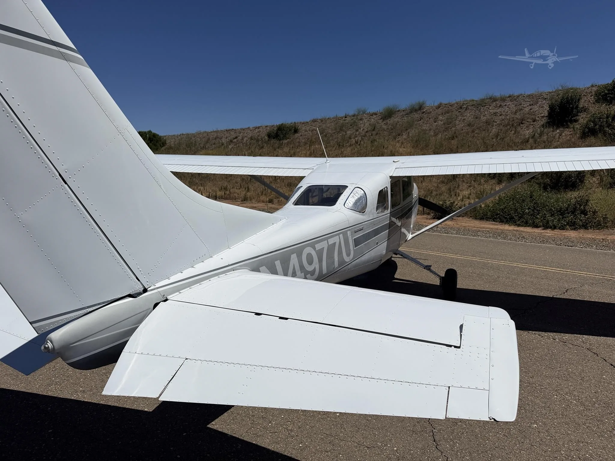 Exterior view of a 1965 CESSNA 210, N4977U.