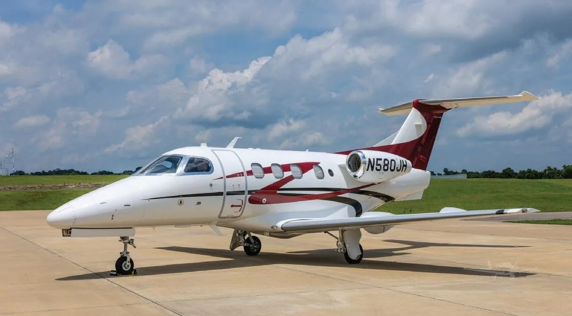 Exterior view of a 2009 EMBRAER PHENOM 100, N580JH.