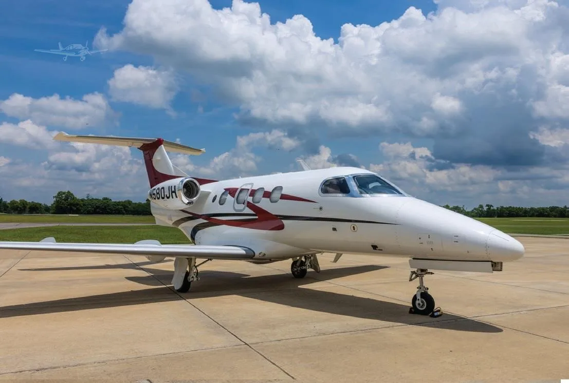 Exterior view of a 2009 EMBRAER PHENOM 100, N580JH.