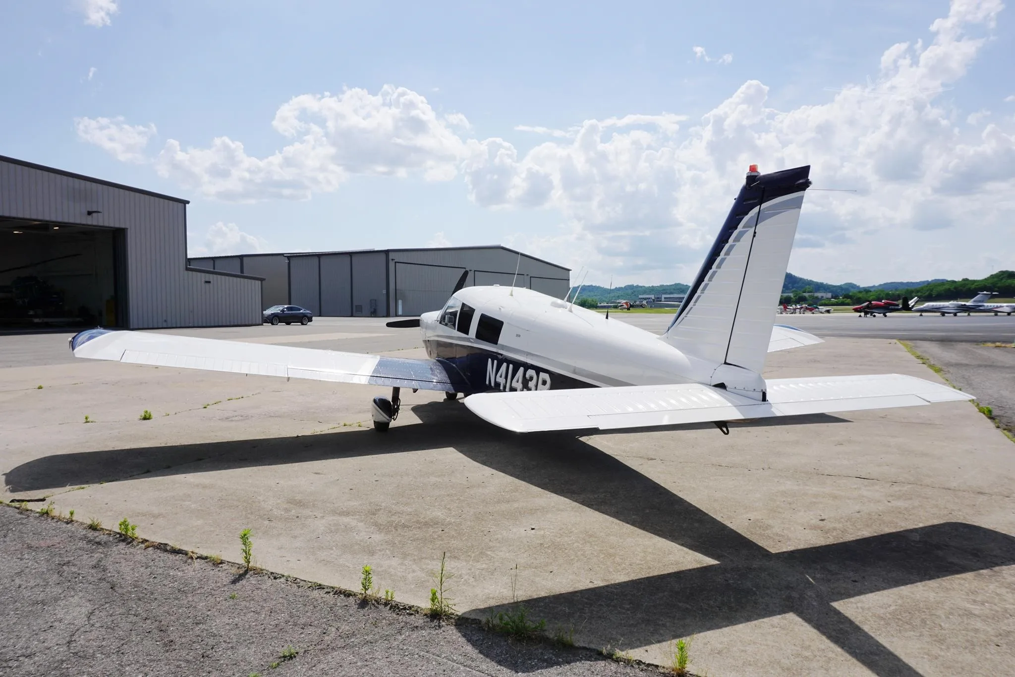 Exterior view of a 1968 PIPER CHEROKEE 6/300, N4143R.