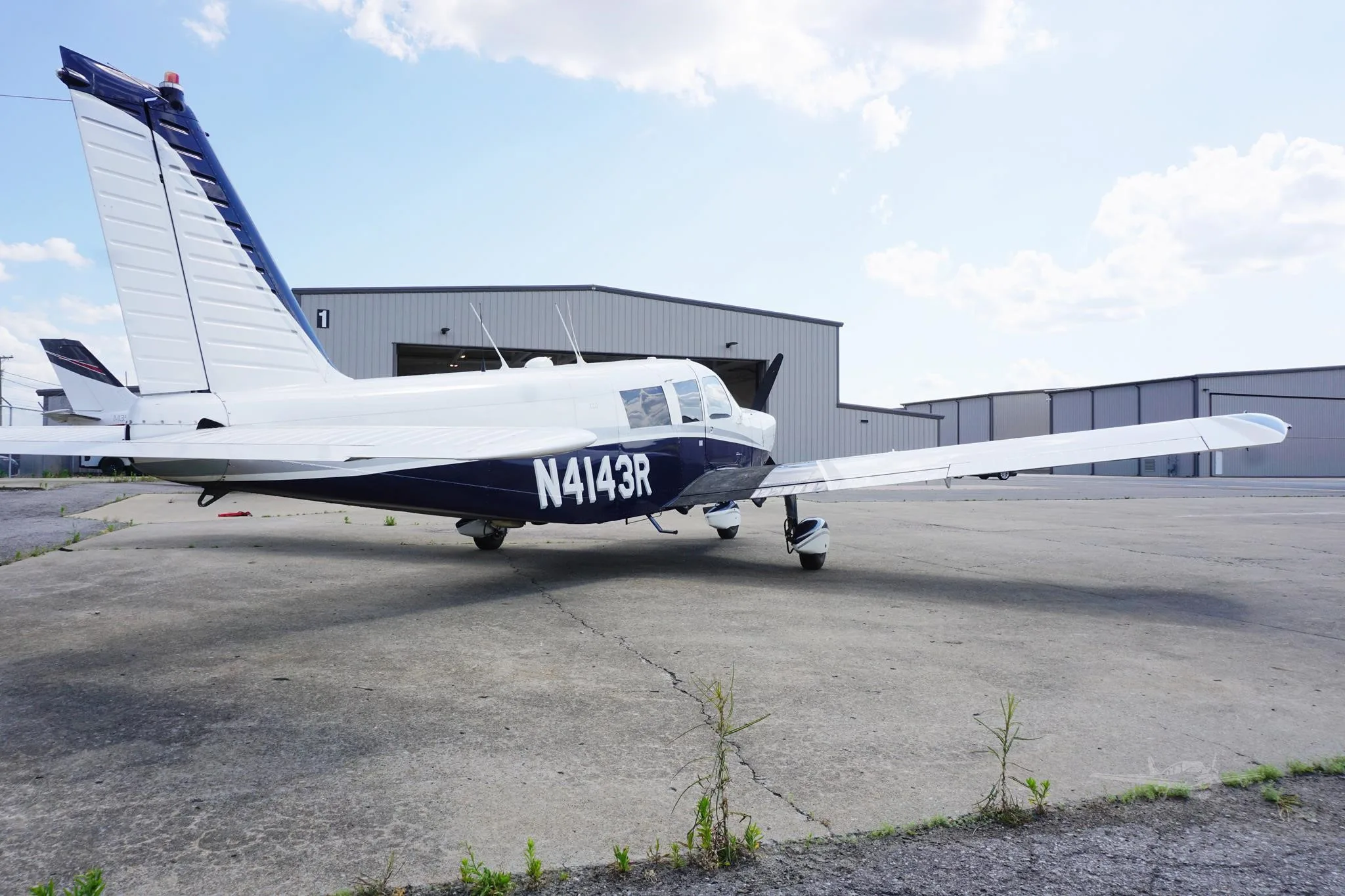 Exterior view of a 1968 PIPER CHEROKEE 6/300, N4143R.