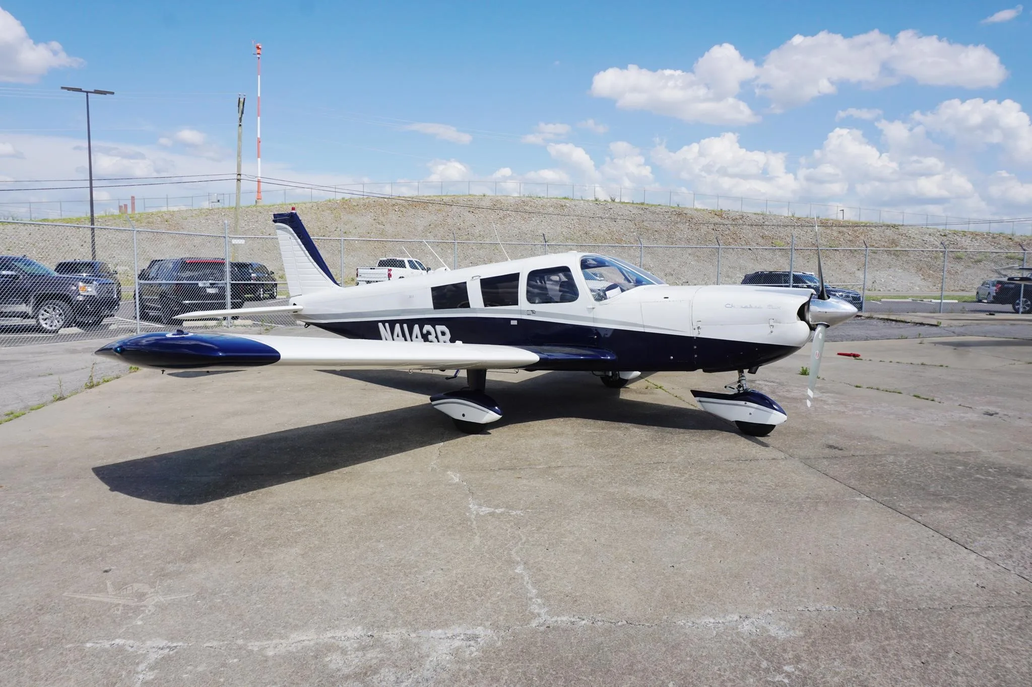Exterior view of a 1968 PIPER CHEROKEE 6/300, N4143R.