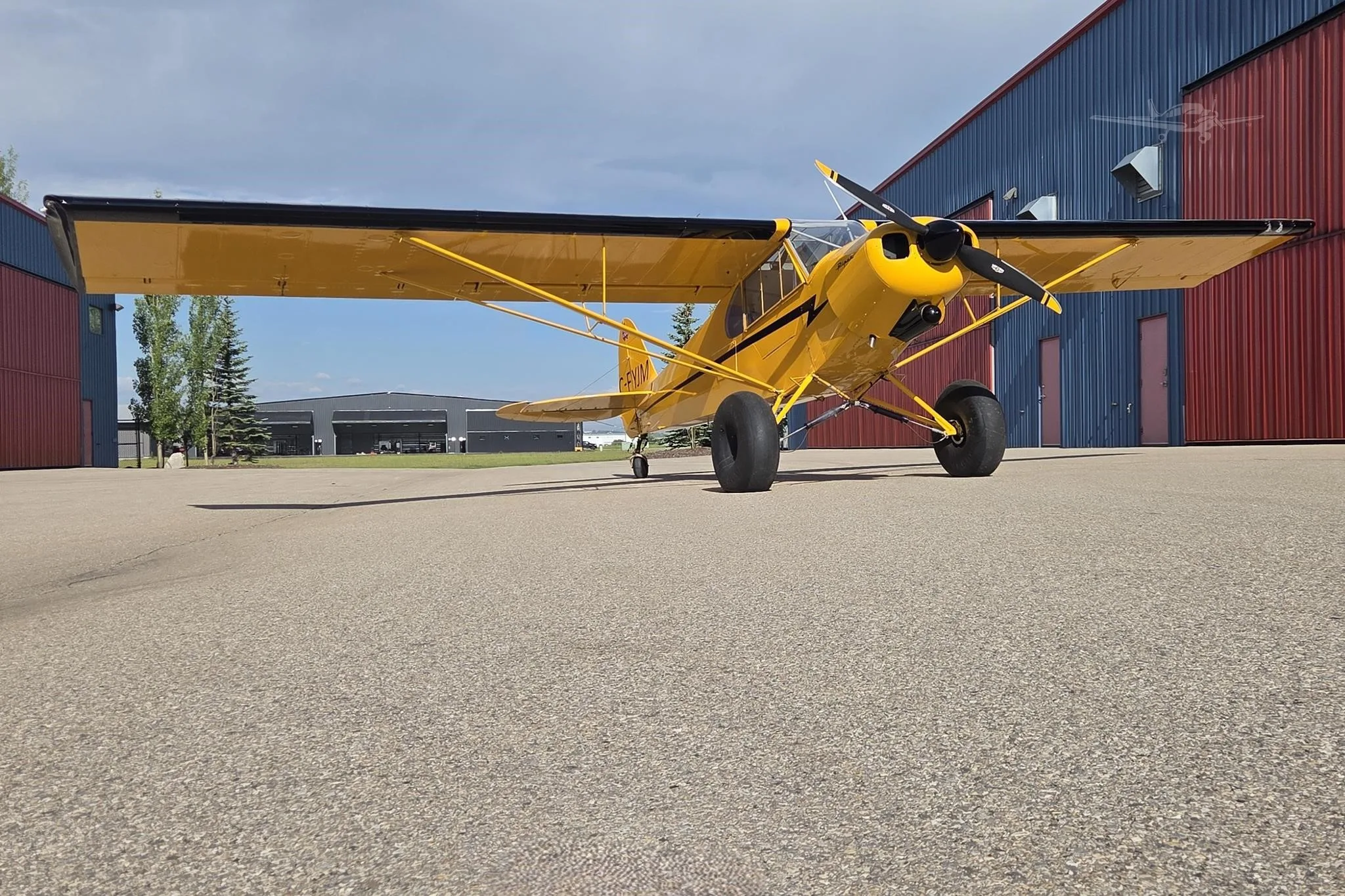 Exterior view of a 1955 PIPER SUPER CUB, C-FYJM.