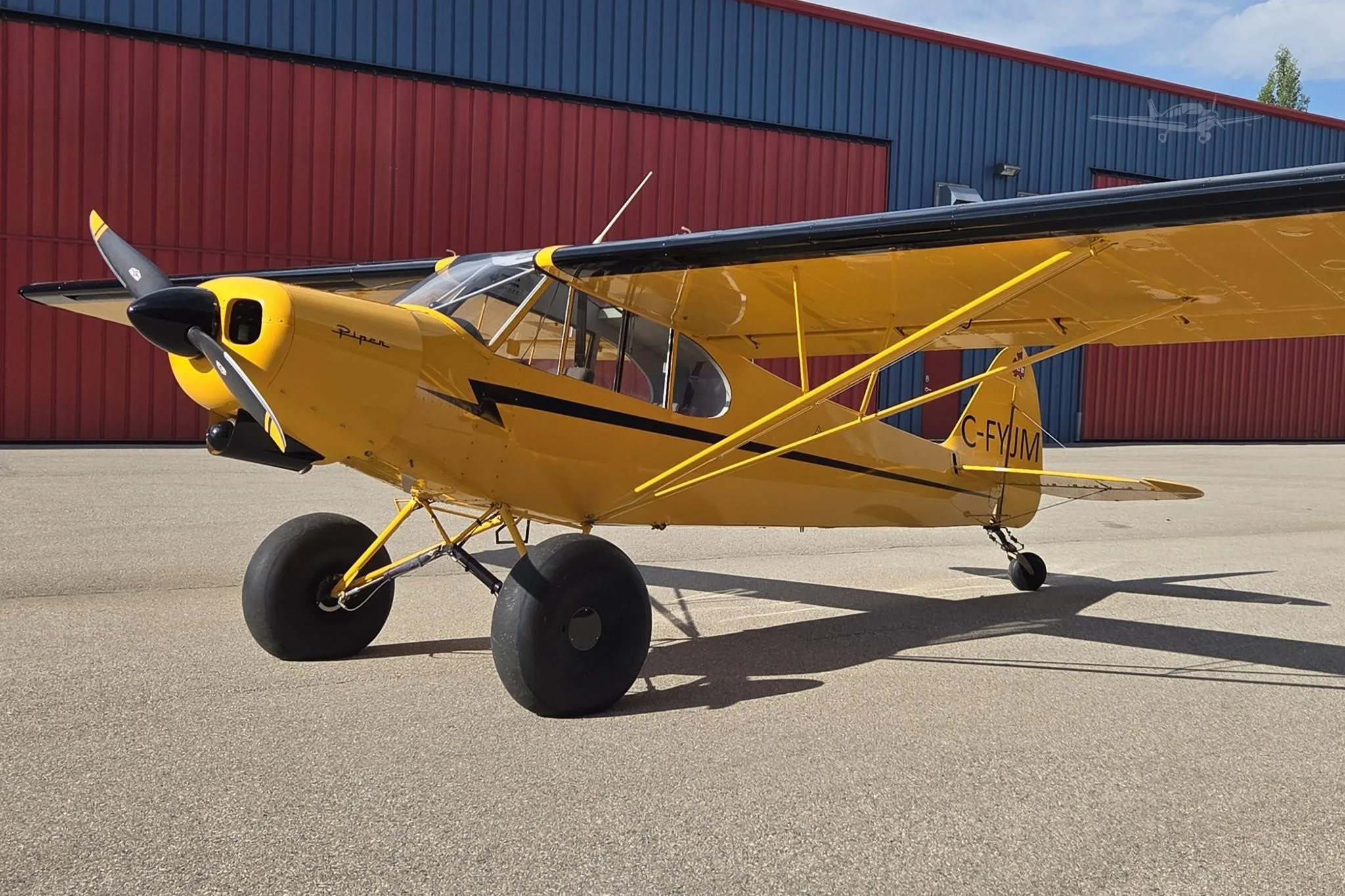 Exterior view of a 1955 PIPER SUPER CUB, C-FYJM.