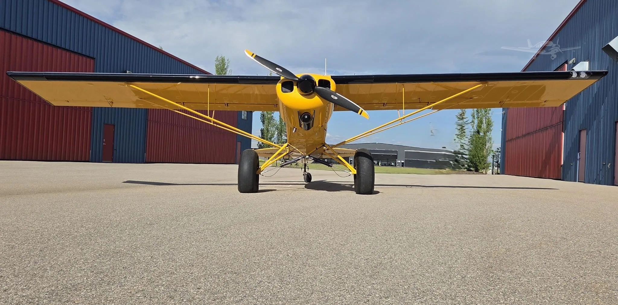 Exterior view of a 1955 PIPER SUPER CUB, C-FYJM.