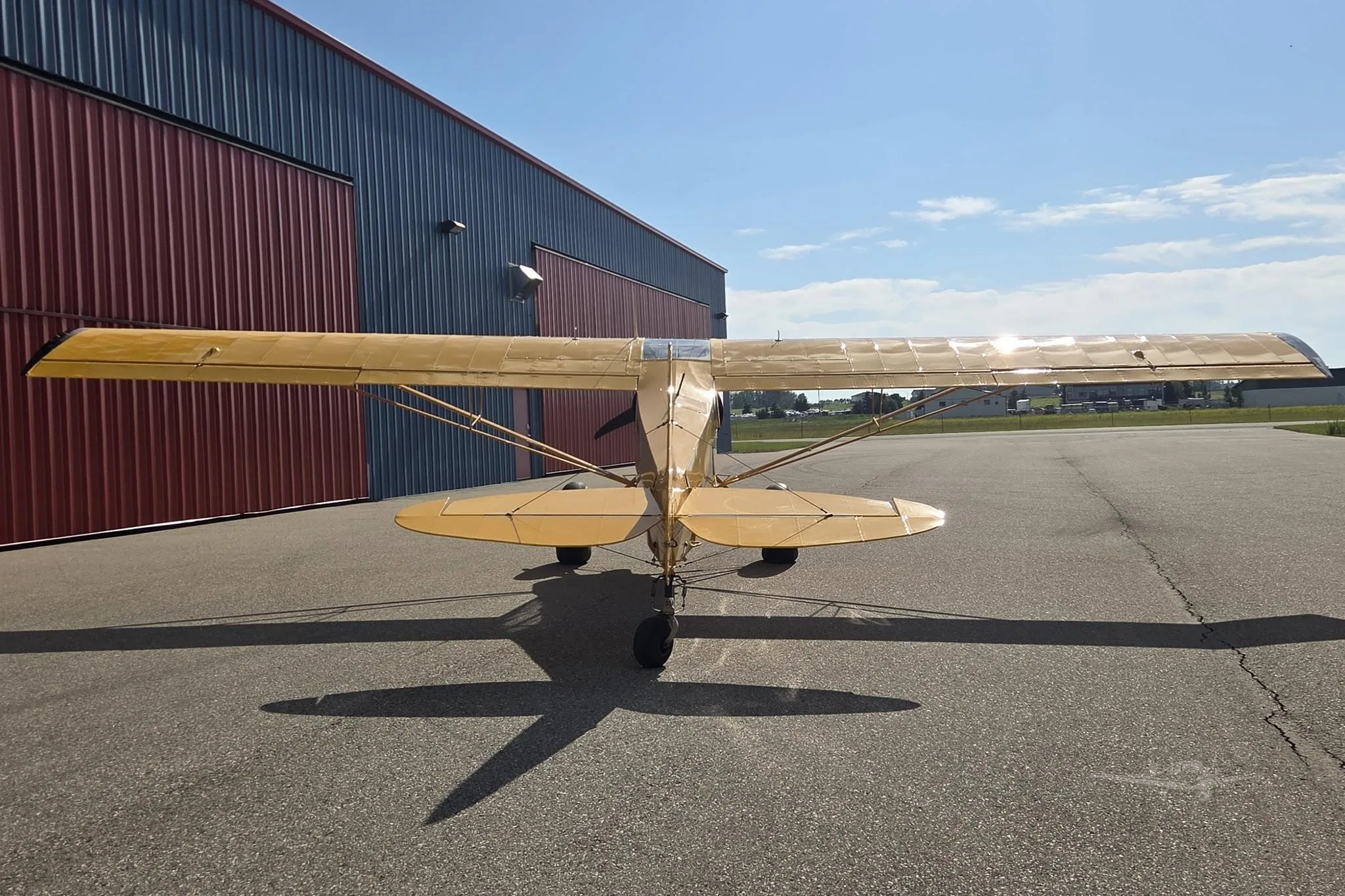Exterior view of a 1955 PIPER SUPER CUB, C-FYJM.
