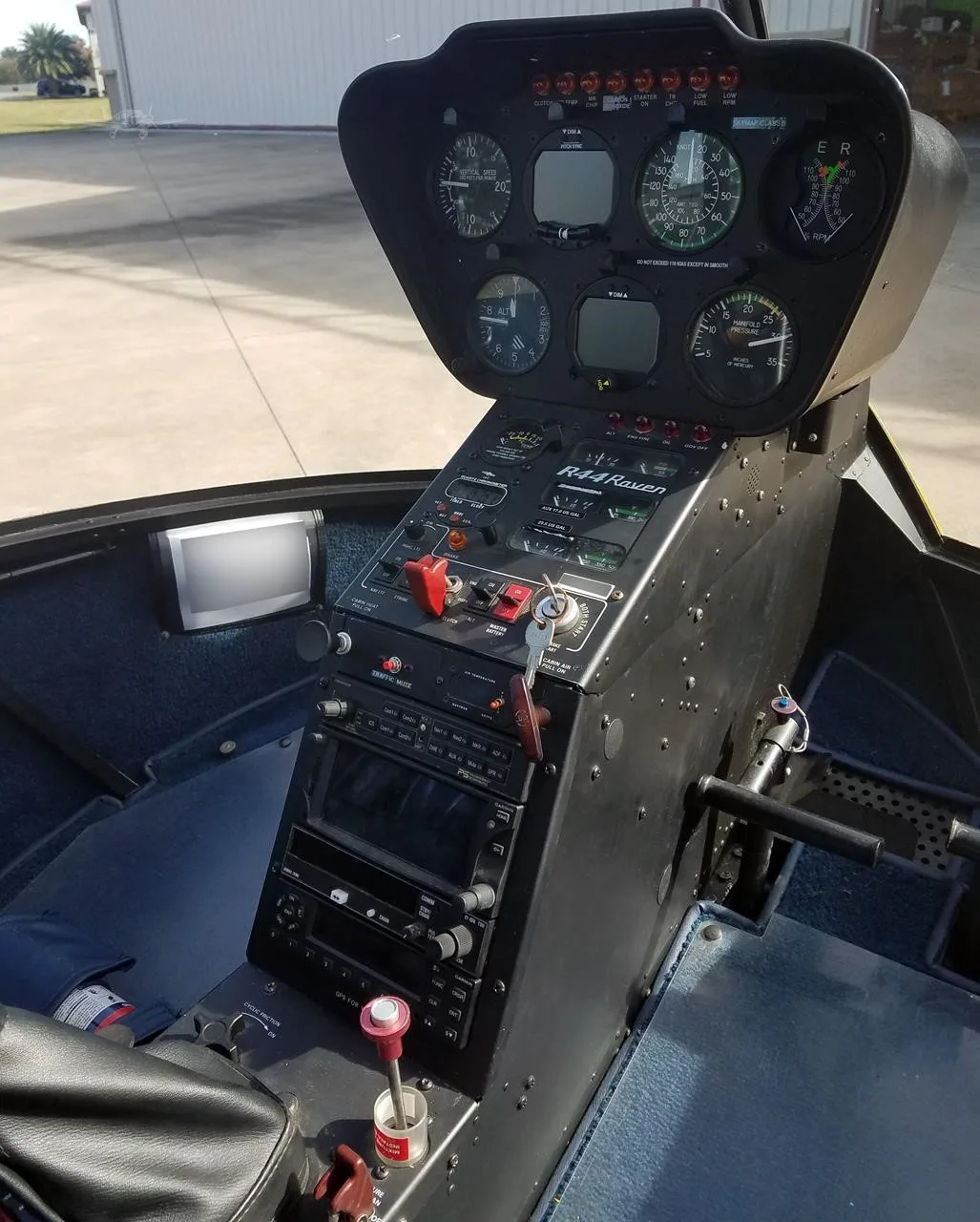 Cockpit and instrument panel of a 2002 ROBINSON R44 RAVEN I.