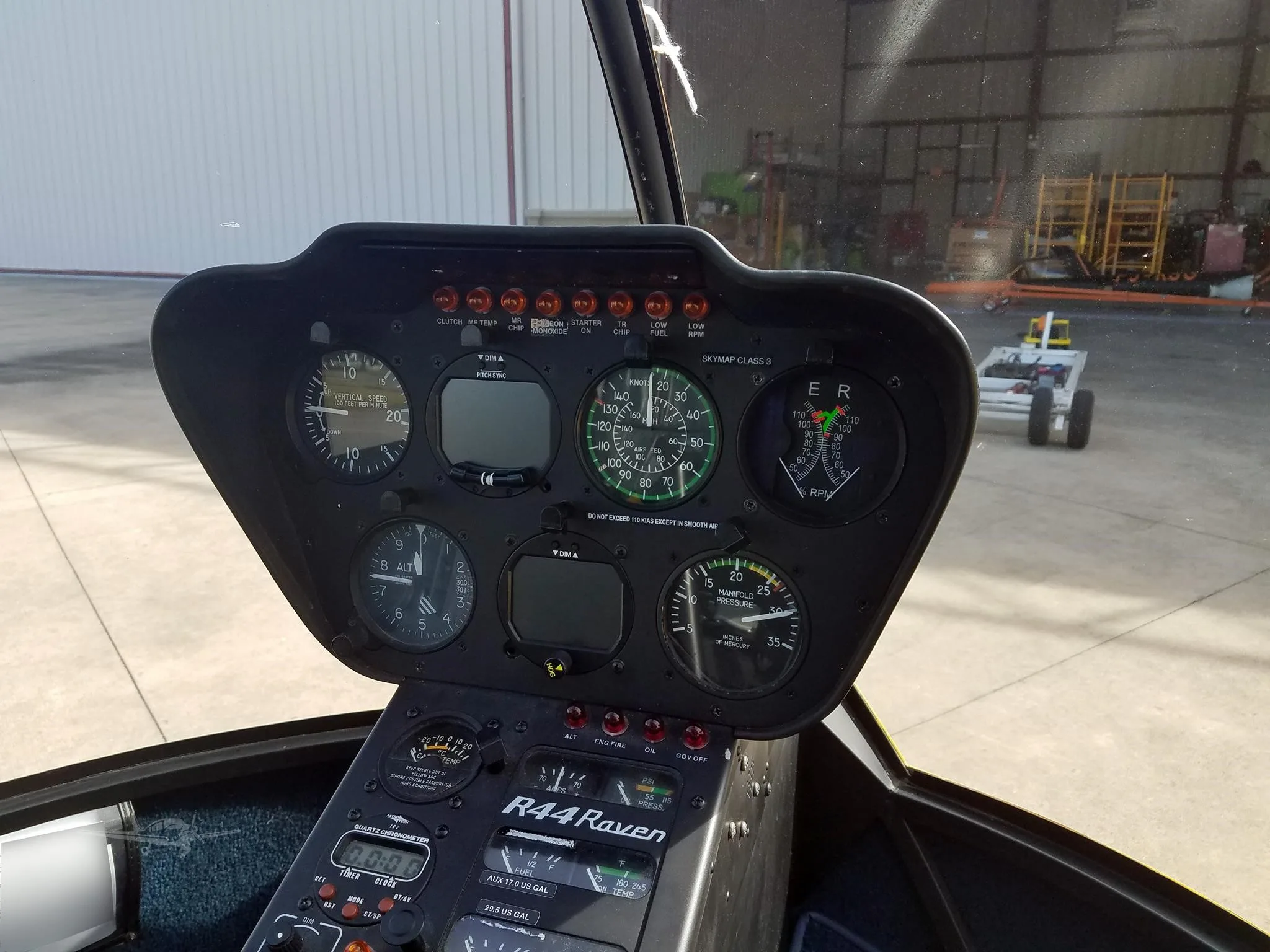 Cockpit and instrument panel of a 2002 ROBINSON R44 RAVEN I.