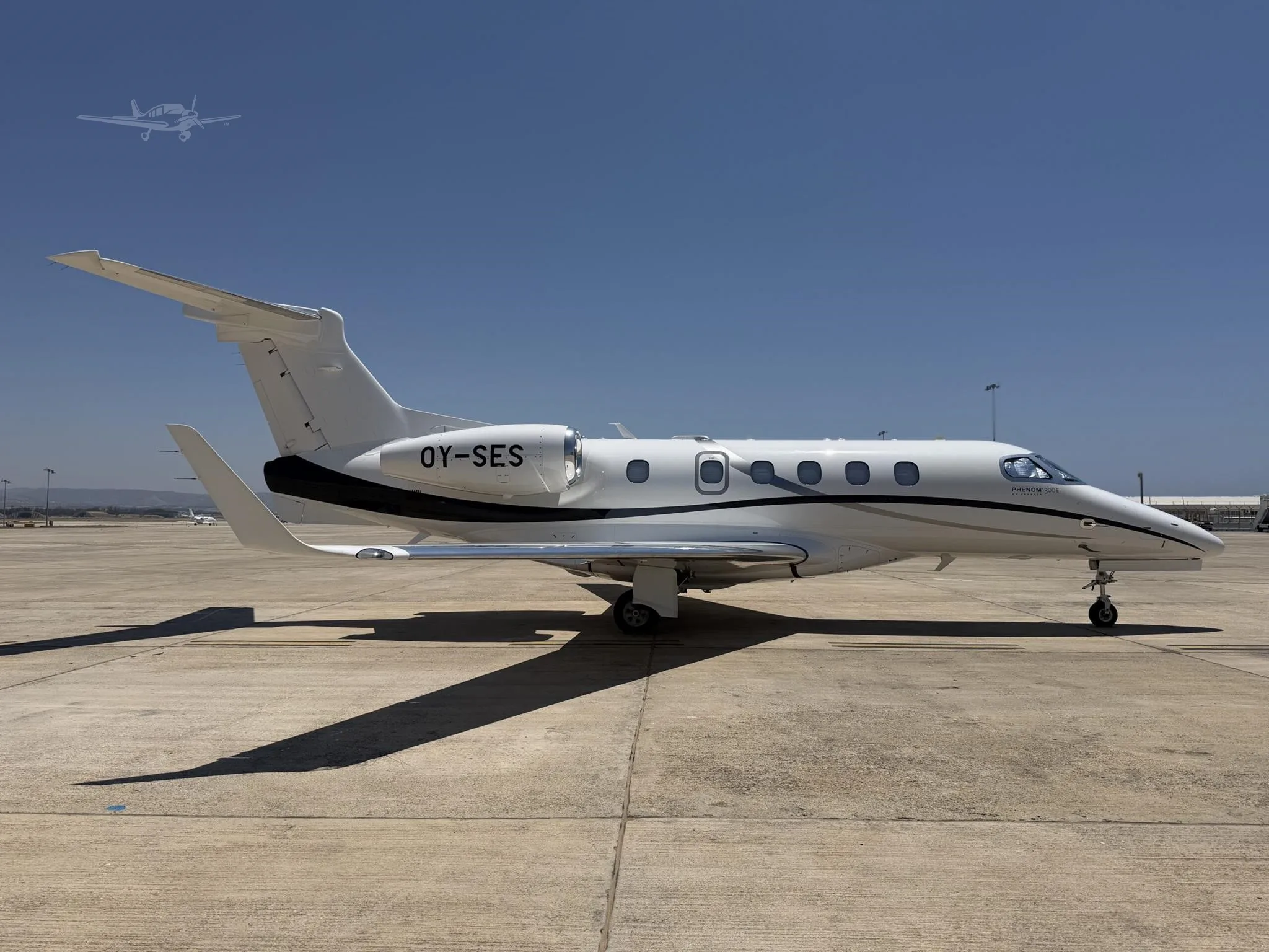Exterior view of a 2024 EMBRAER PHENOM 300E, OY-SES.