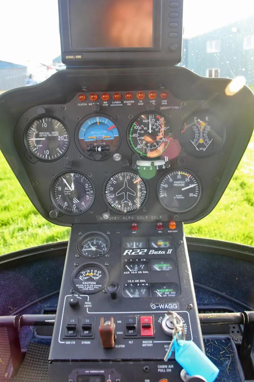 Cockpit and instrument panel of a 1999 ROBINSON R22 BETA II.