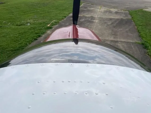 Engine detail of a 1965 BEECHCRAFT S35 BONANZA.