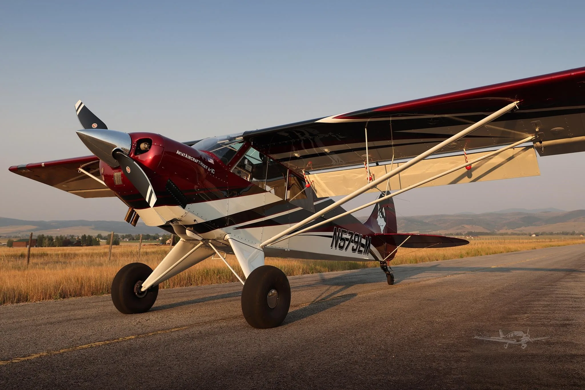 Exterior view of a 2025 AVIAT HUSKY A-1C-200, N579LM.