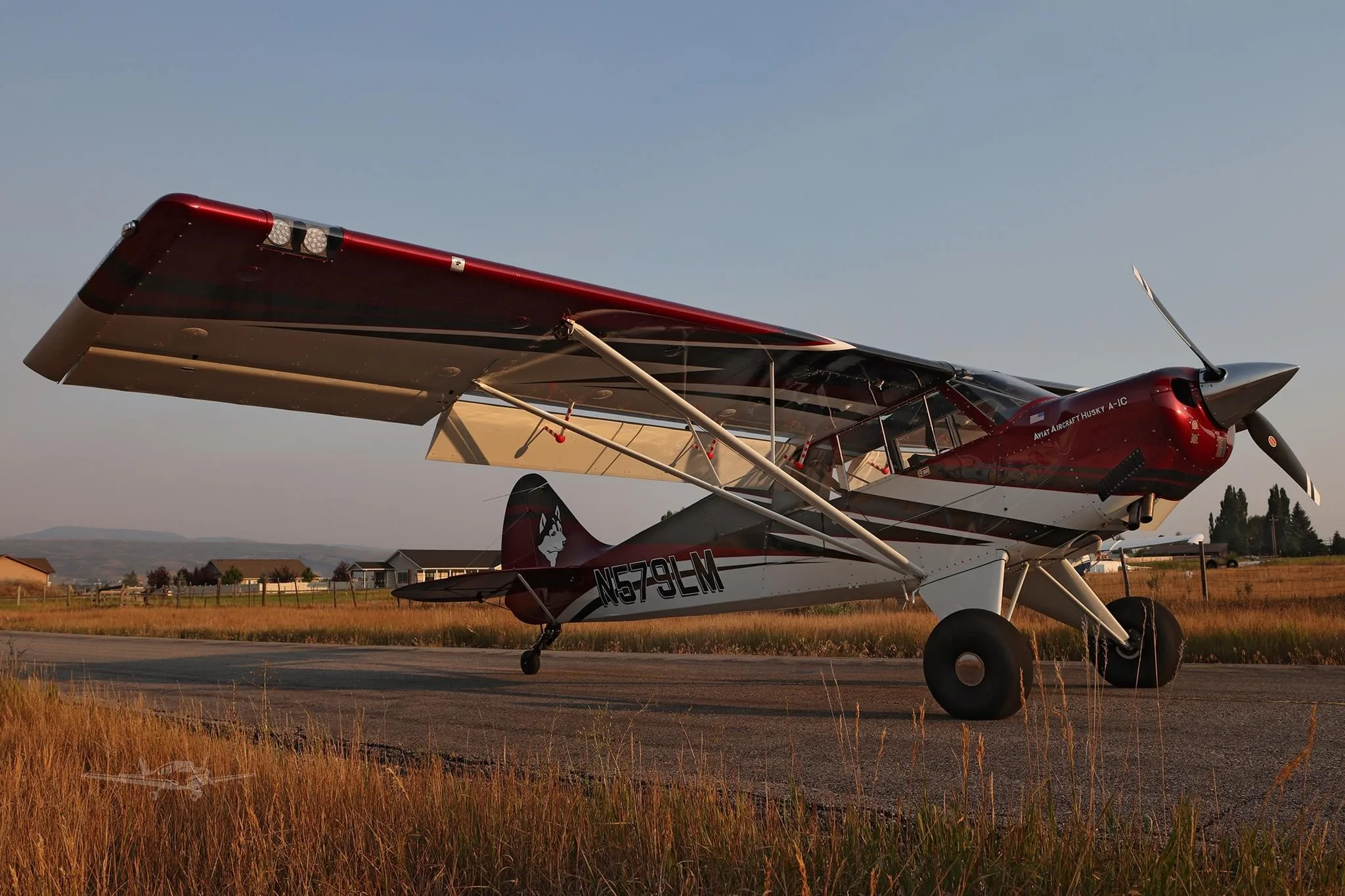 Exterior view of a 2025 AVIAT HUSKY A-1C-200, N579LM.