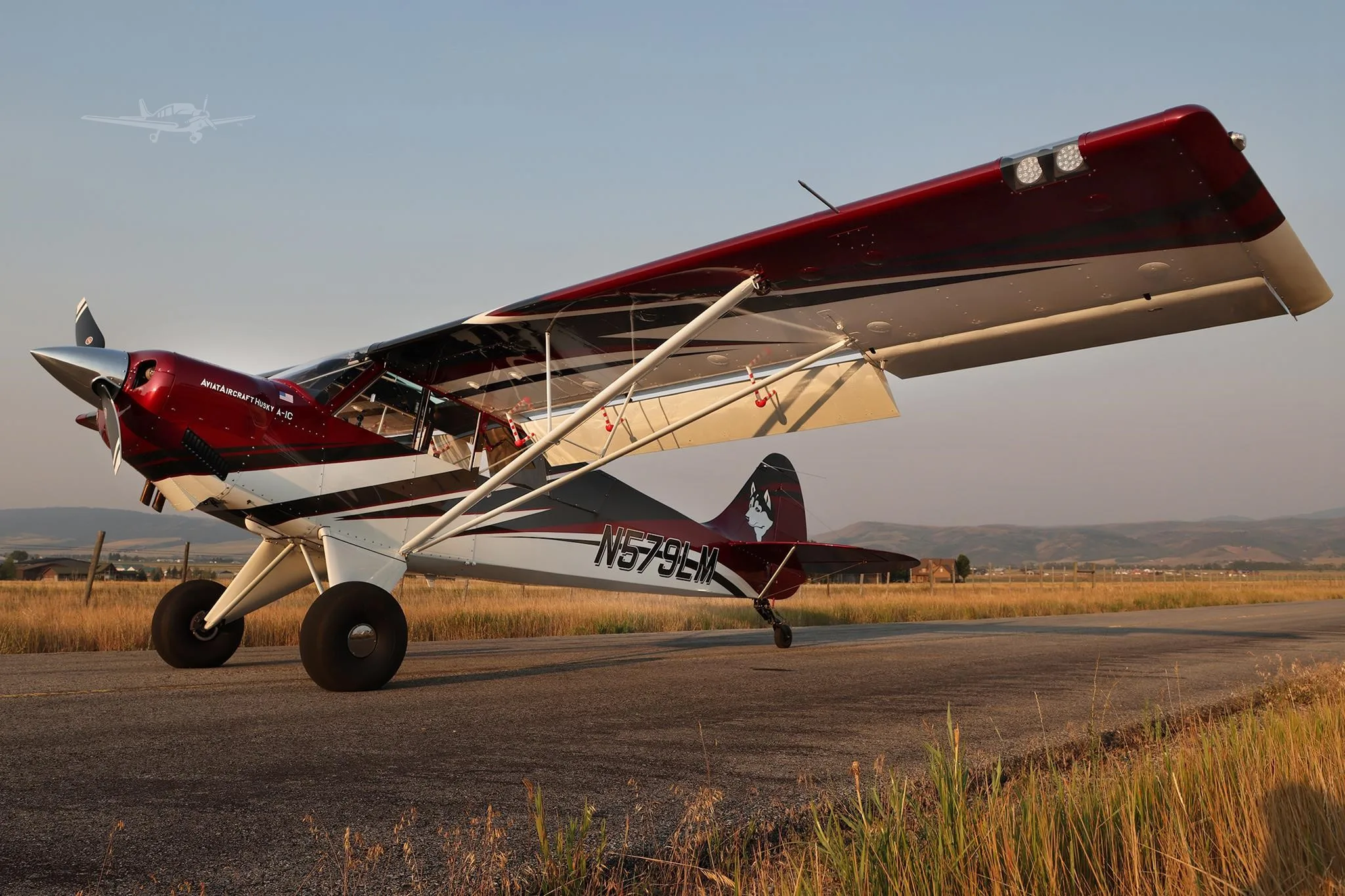 Exterior view of a 2025 AVIAT HUSKY A-1C-200, N579LM.