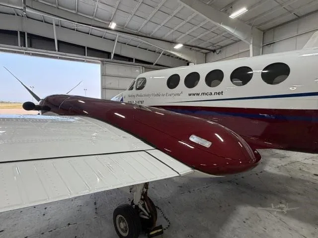 Exterior view of a 2004 BEECHCRAFT KING AIR B200, N597BA.