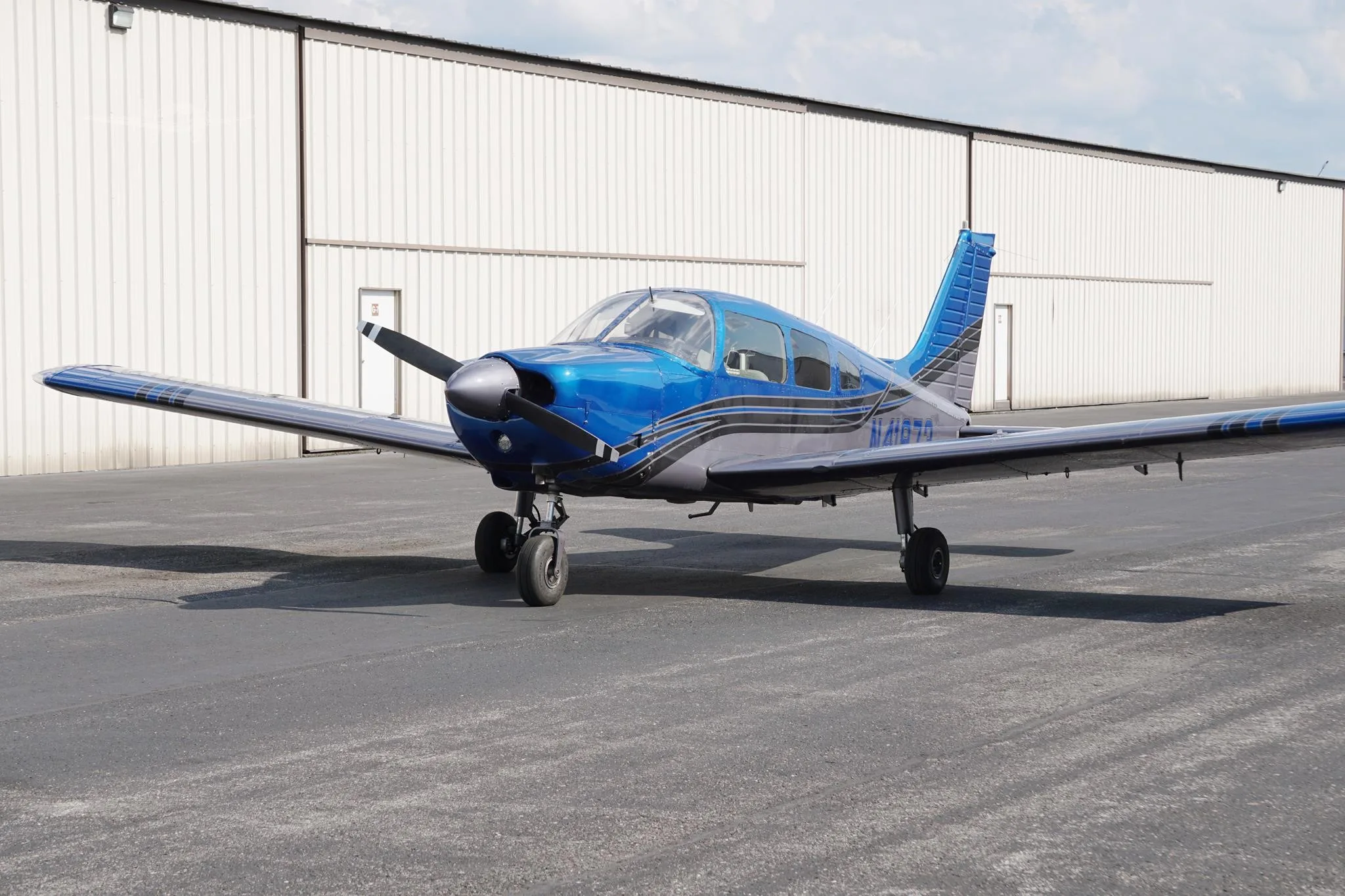 Exterior view of a 1974 PIPER ARCHER, N41973.