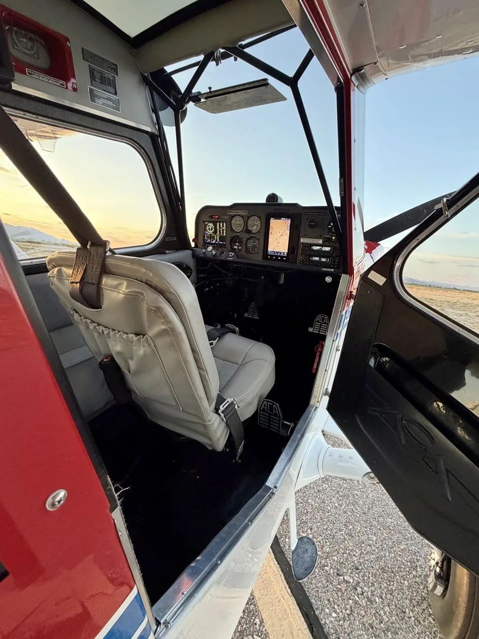 Cockpit and instrument panel of a 2019 AMERICAN CHAMPION 7-GCBC HIGH COUNTRY EXPLORER.