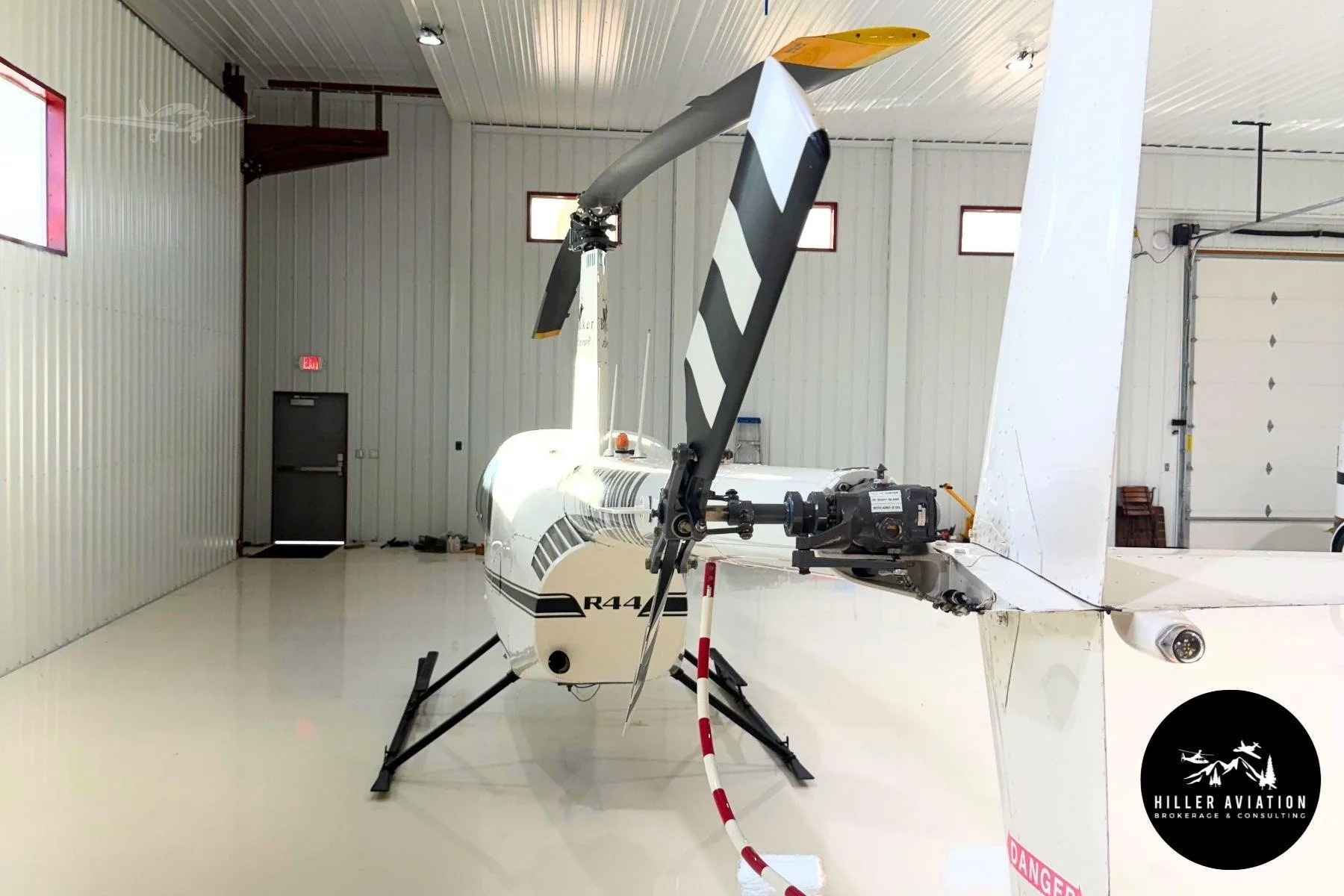 Exterior view of a 2006 ROBINSON R44 RAVEN II, N442WM.