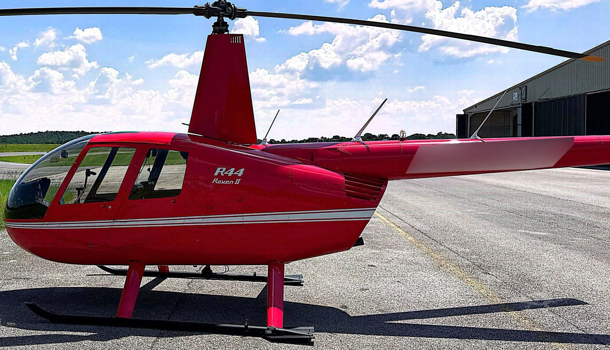 Exterior view of a 2012 ROBINSON R44 RAVEN II.