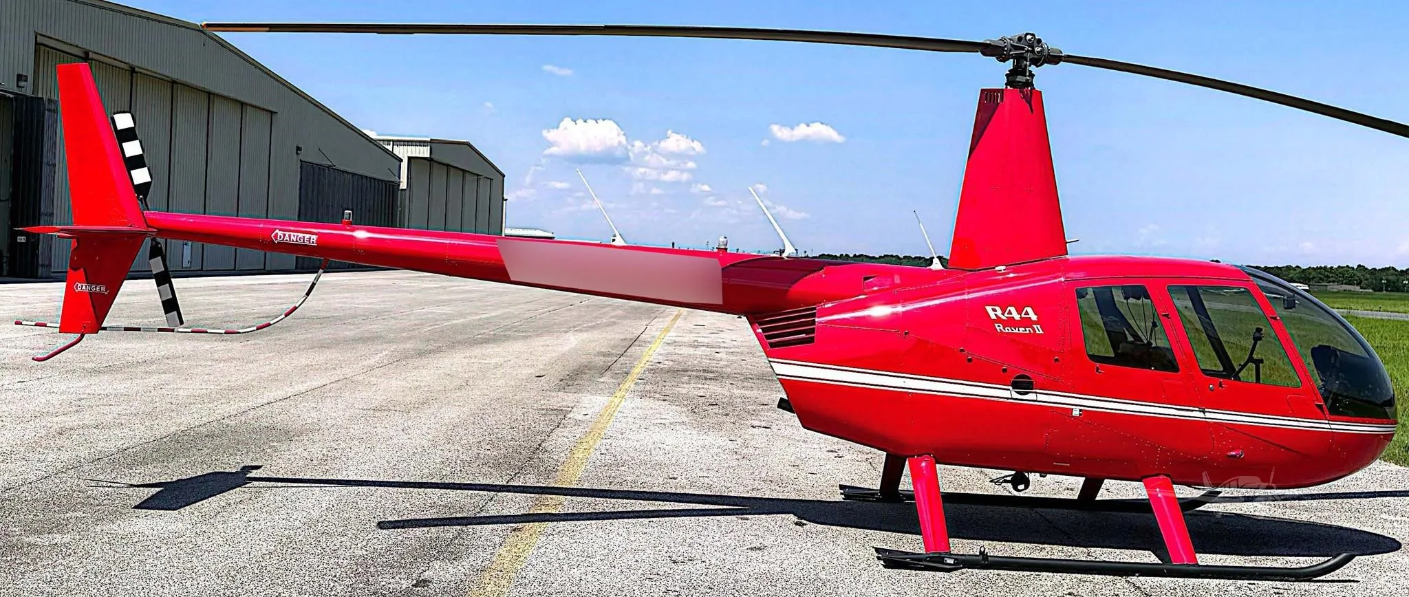 Exterior view of a 2012 ROBINSON R44 RAVEN II.