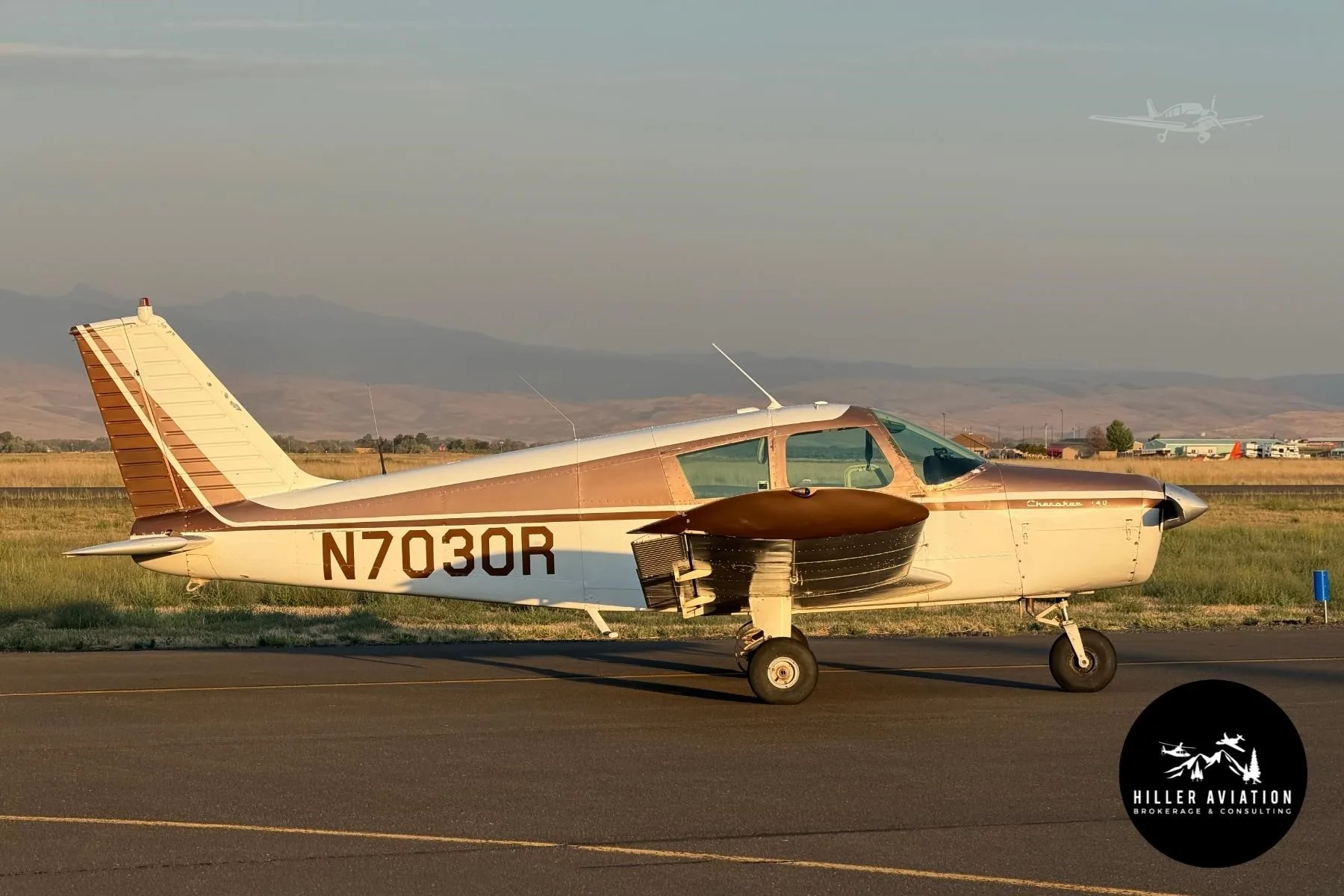 Exterior view of a 1966 PIPER CHEROKEE 140, N7030R.