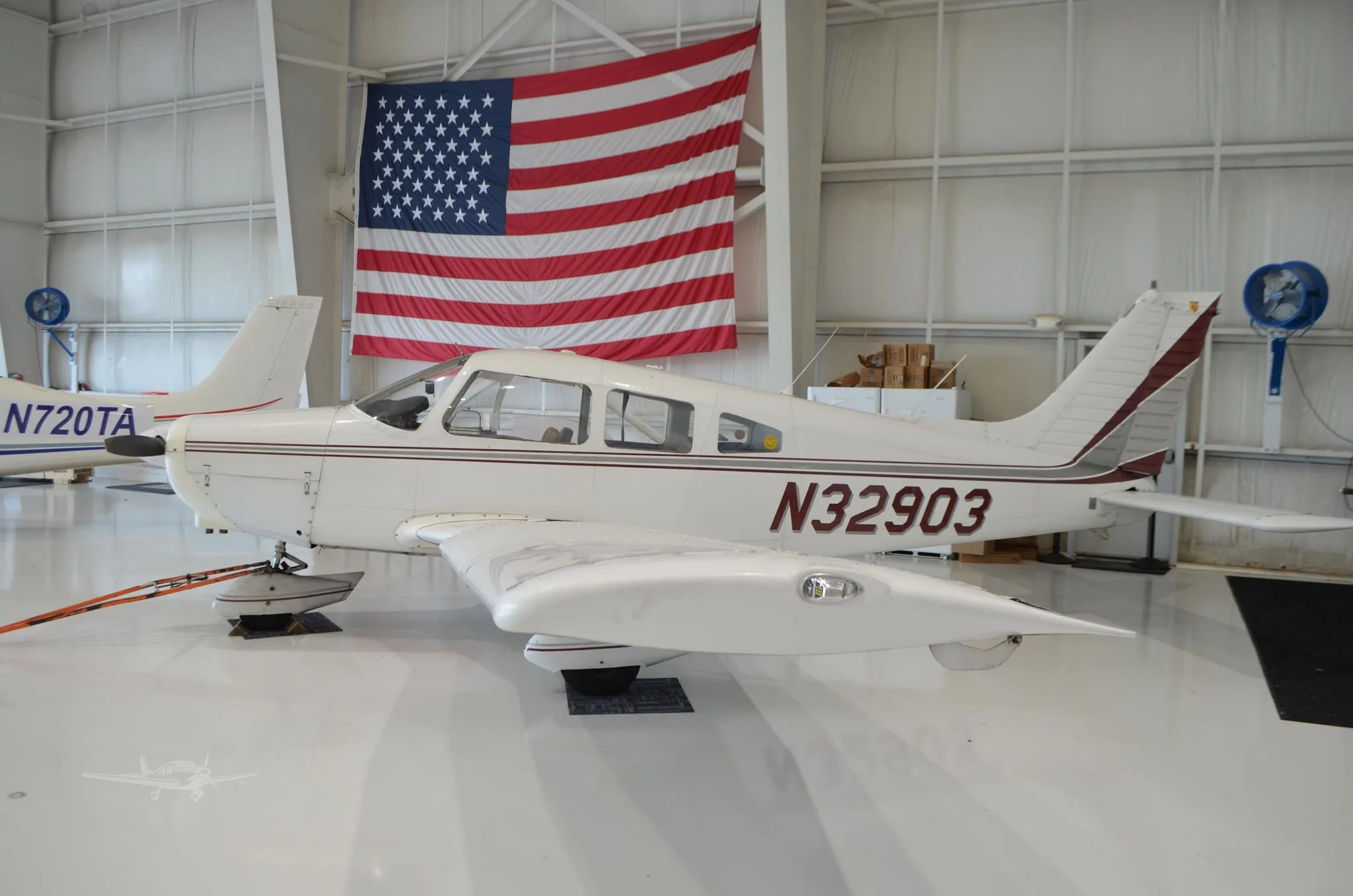 Exterior view of a 1974 PIPER WARRIOR, N32903.