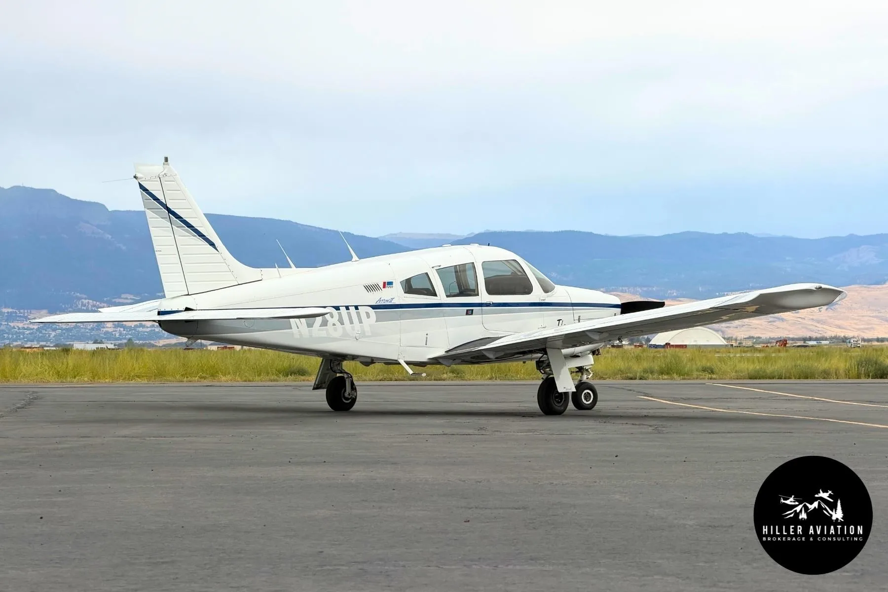 Exterior view of a 1973 PIPER ARROW II, N28UP.