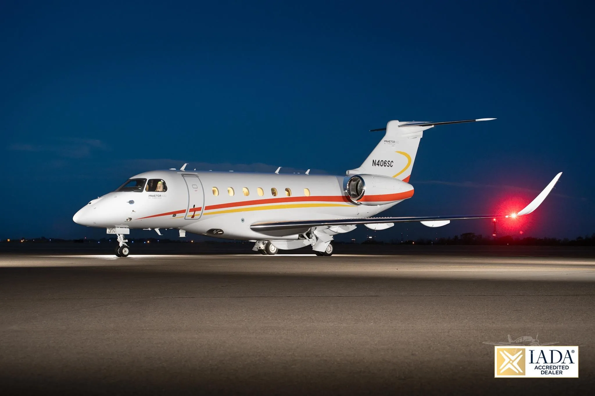 Exterior view of a 2021 EMBRAER PRAETOR 600, N406SC.