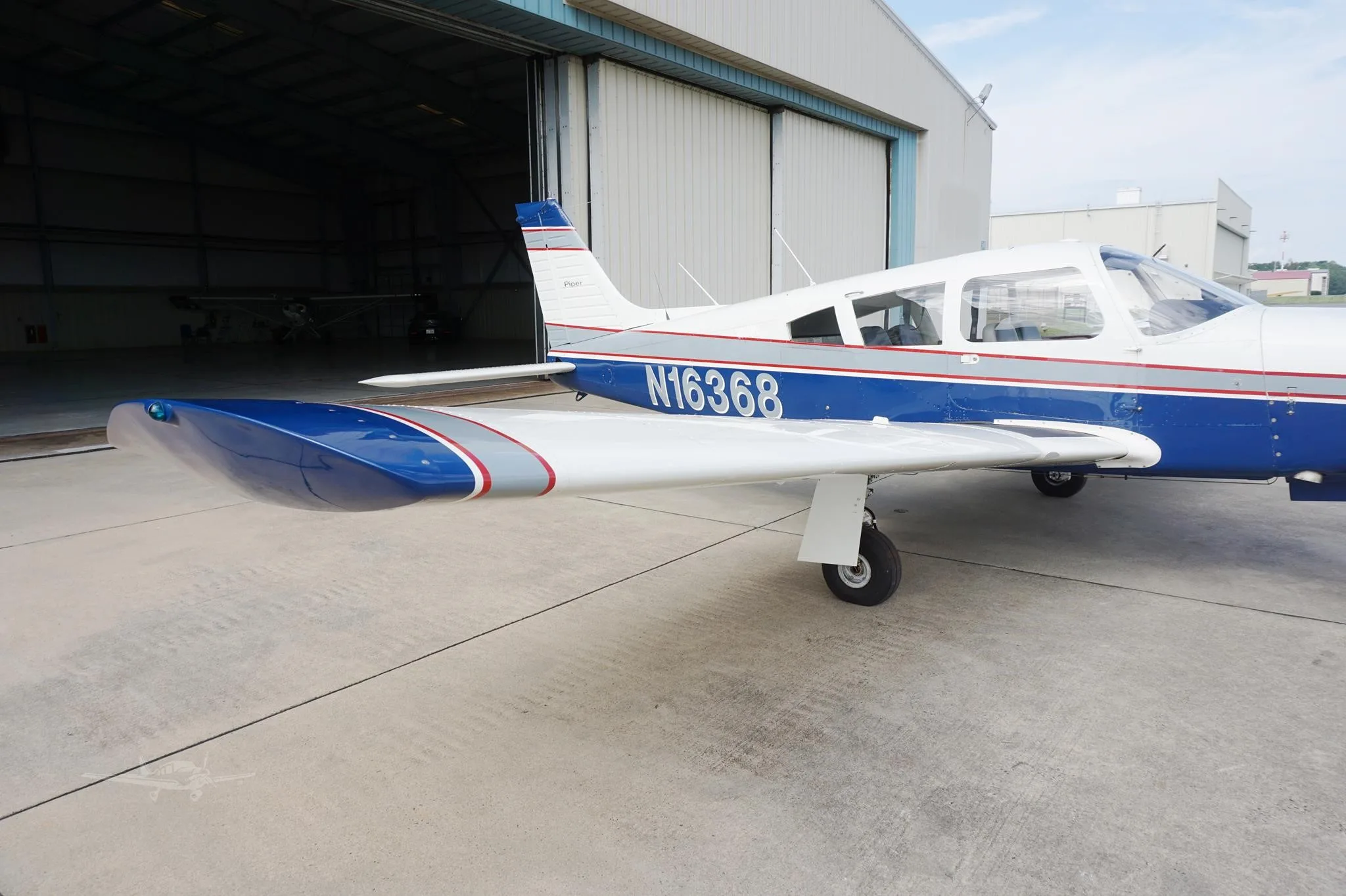 Exterior view of a 1973 PIPER ARROW II, N16368.