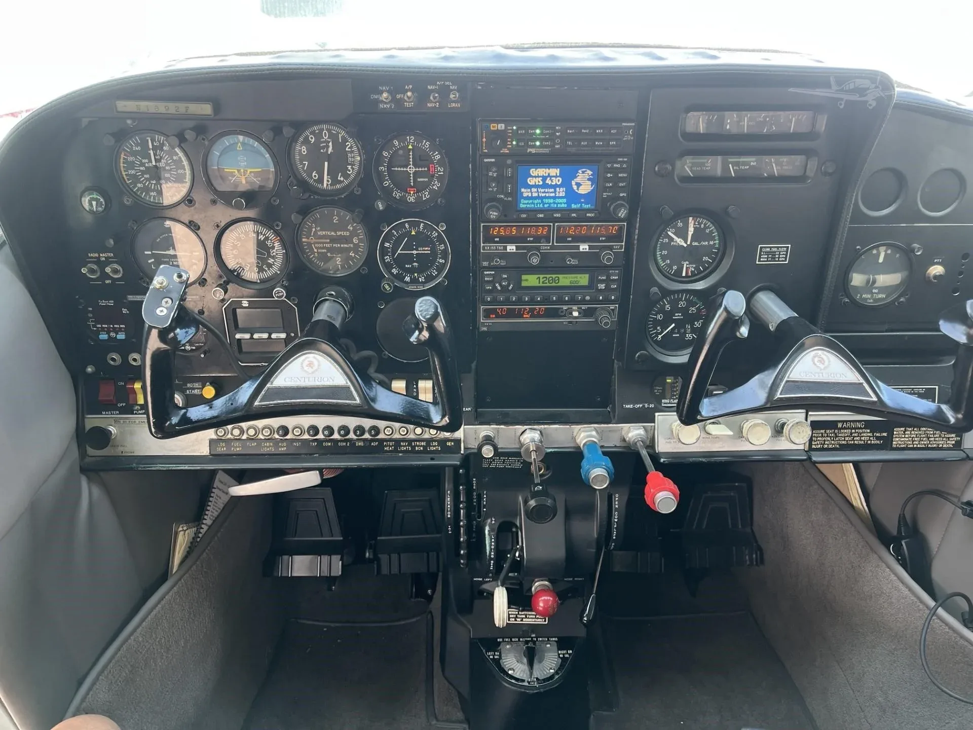 Cockpit and instrument panel of a 1966 CESSNA 210.