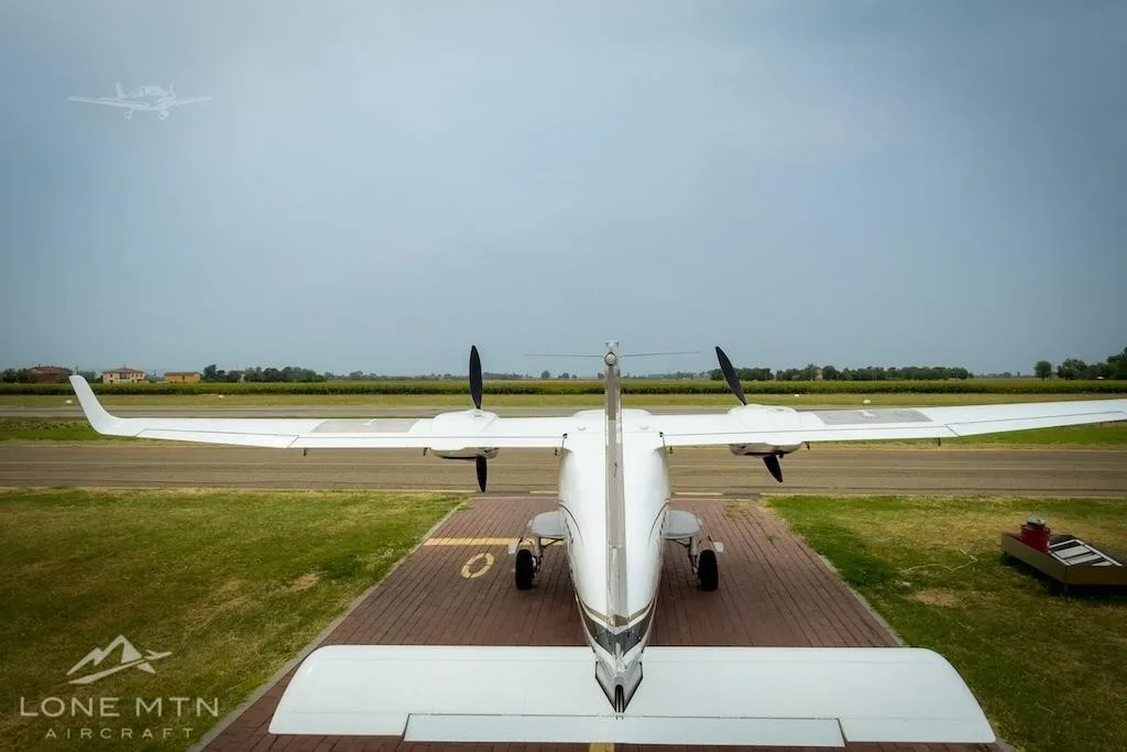 Exterior view of a 2017 TECNAM P2006T, I-OZZC.