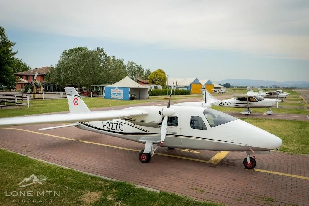 Exterior view of a 2017 TECNAM P2006T, I-OZZC.