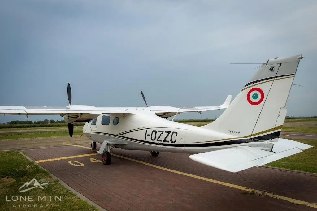 Exterior view of a 2017 TECNAM P2006T, I-OZZC.