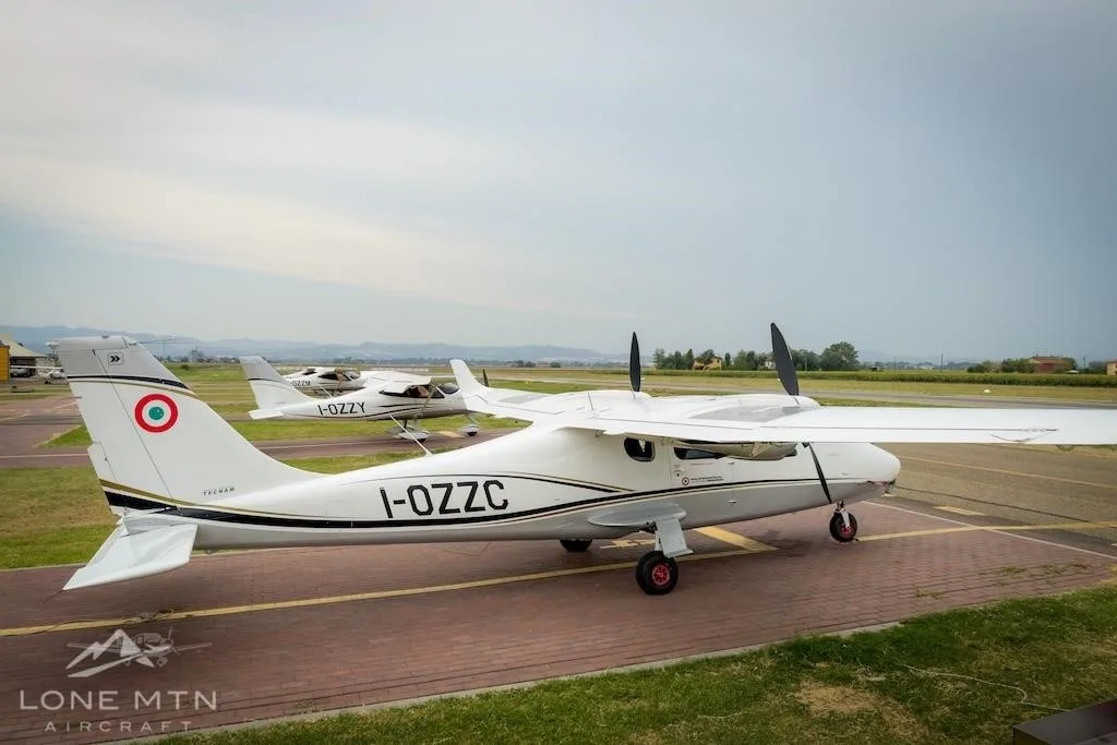 Exterior view of a 2017 TECNAM P2006T, I-OZZC.