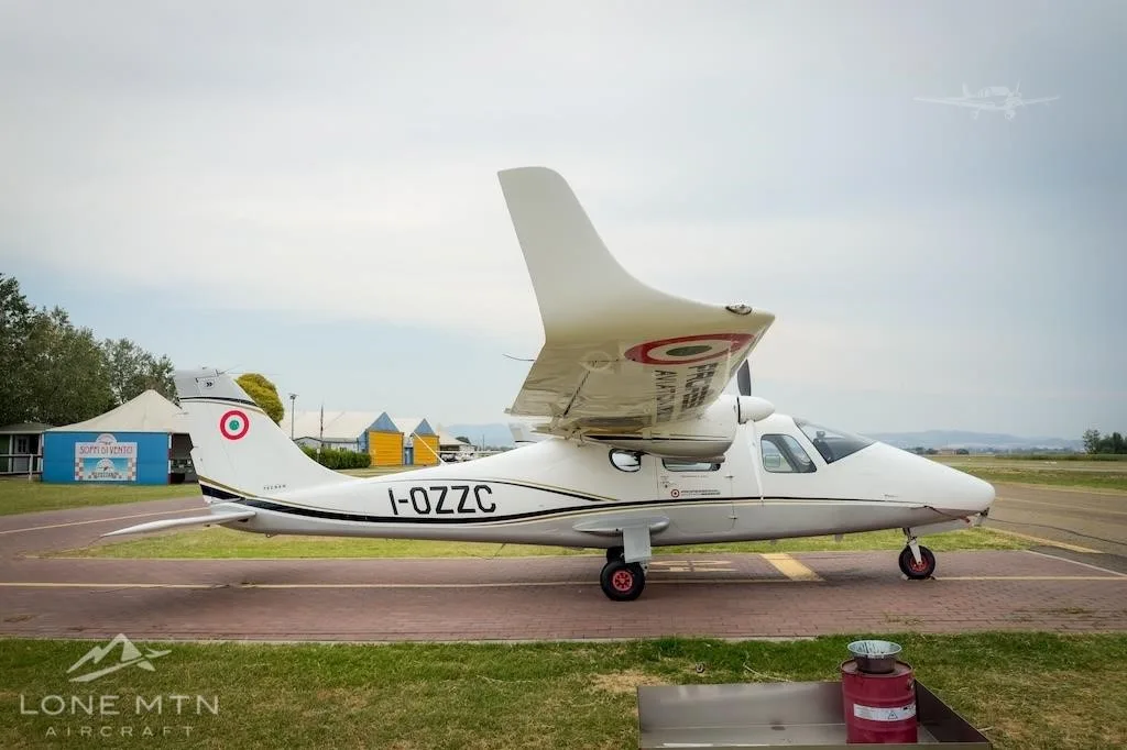 Exterior view of a 2017 TECNAM P2006T, I-OZZC.