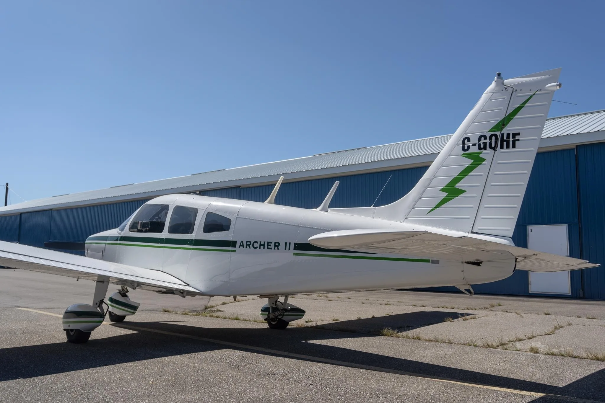 Exterior view of a 1977 PIPER ARCHER II, C-GQHF.