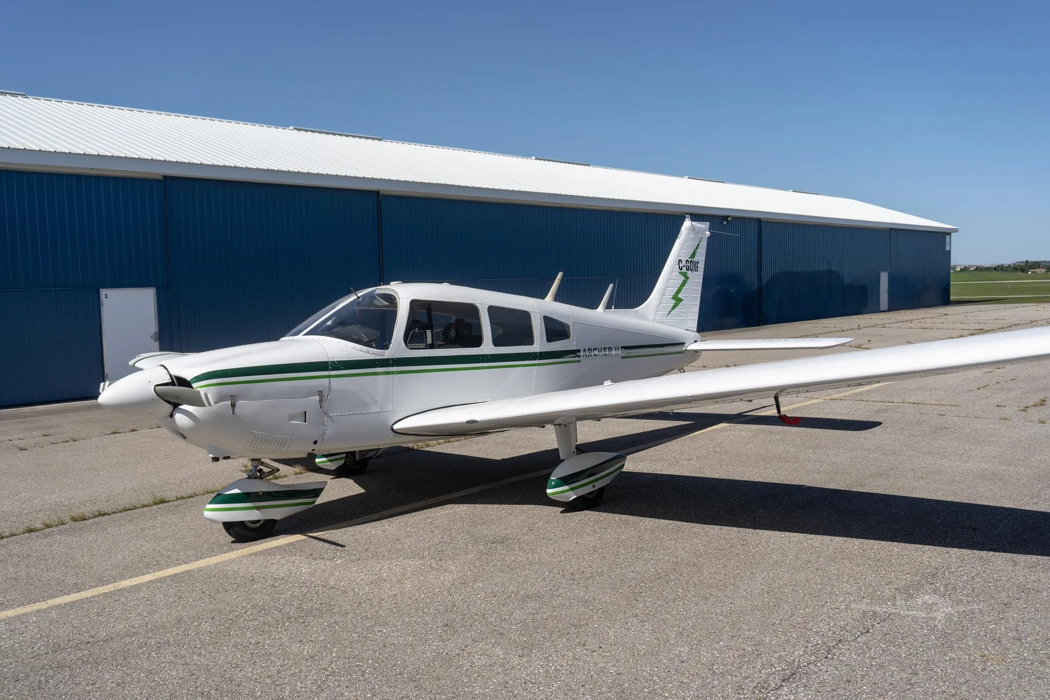 Exterior view of a 1977 PIPER ARCHER II, C-GQHF.