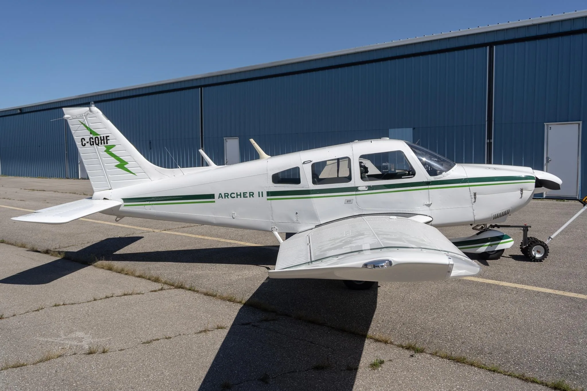 Exterior view of a 1977 PIPER ARCHER II, C-GQHF.