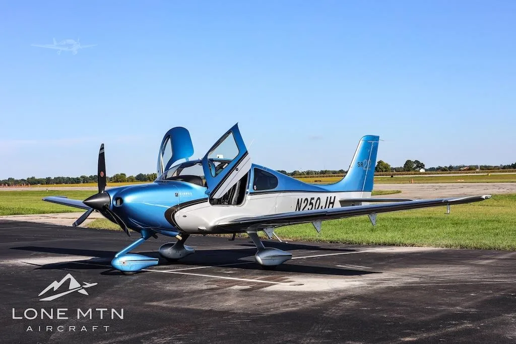 Exterior view of a 2013 CIRRUS SR22-G5, N250JH.