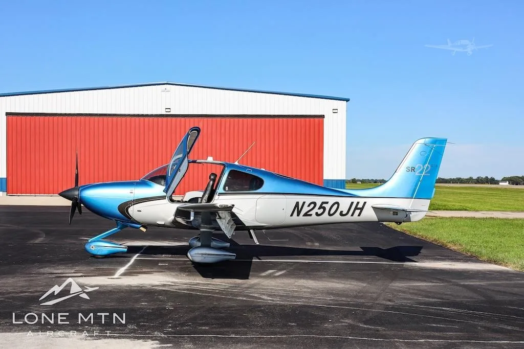 Exterior view of a 2013 CIRRUS SR22-G5, N250JH.