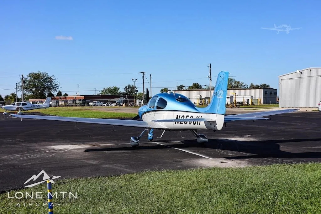 Exterior view of a 2013 CIRRUS SR22-G5, N250JH.