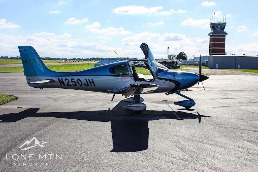 Exterior view of a 2013 CIRRUS SR22-G5, N250JH.