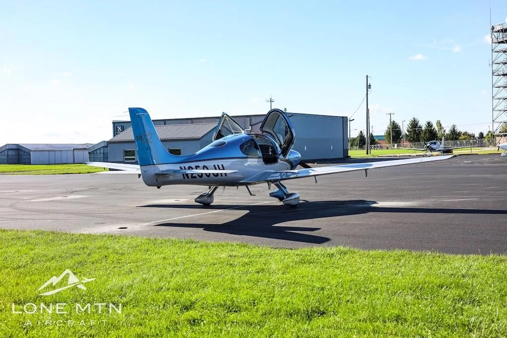 Exterior view of a 2013 CIRRUS SR22-G5, N250JH.