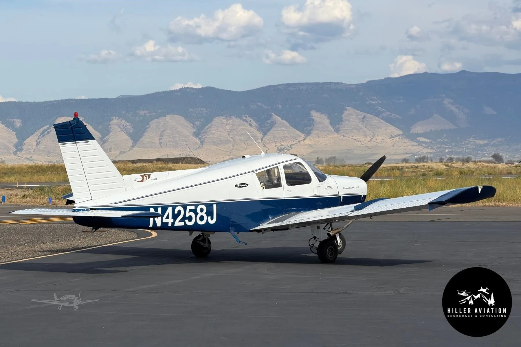 Exterior view of a 1967 PIPER CHEROKEE 140, N4258J.