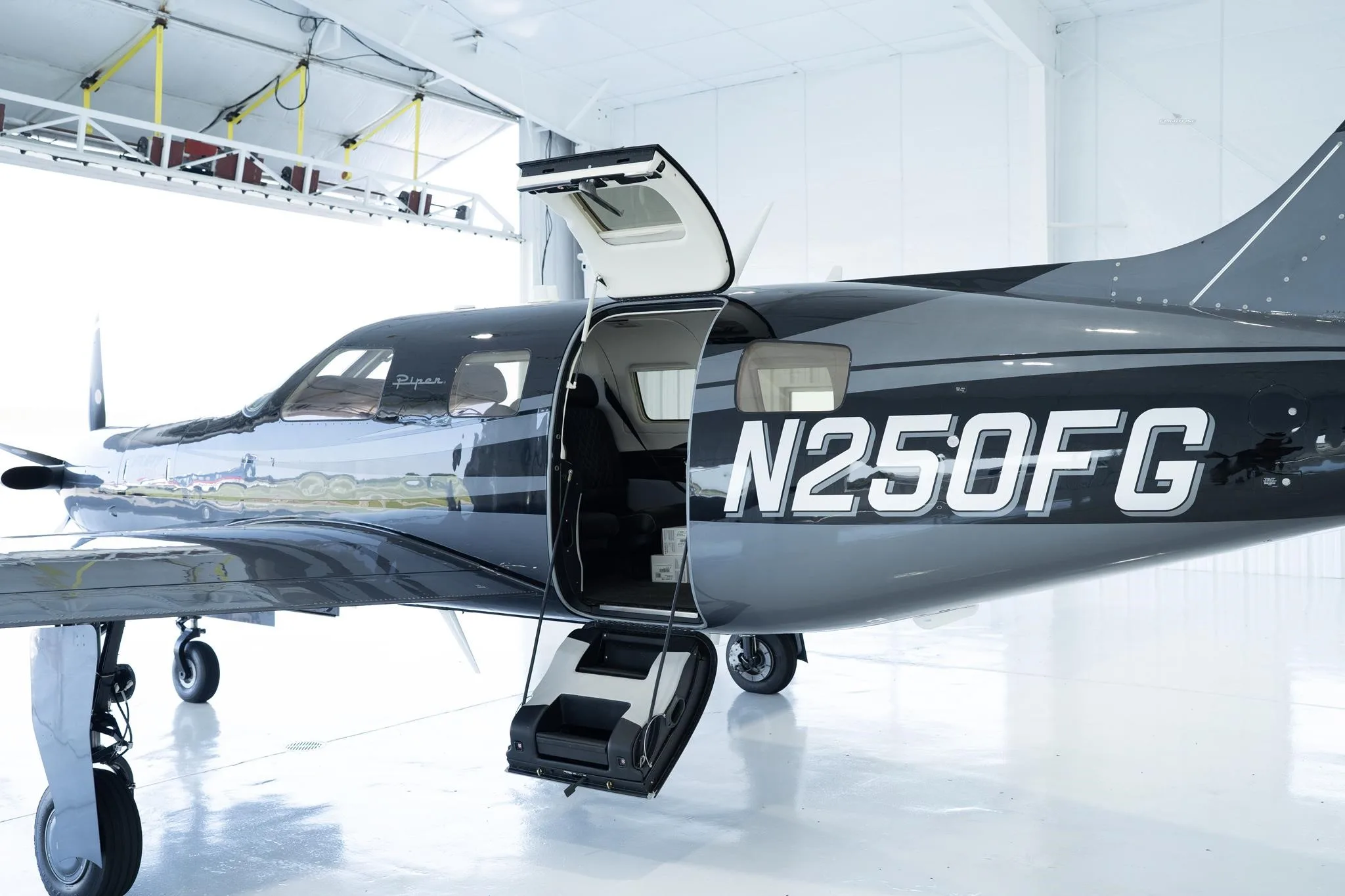 Exterior view of a 2026 PIPER M700, N250FG.