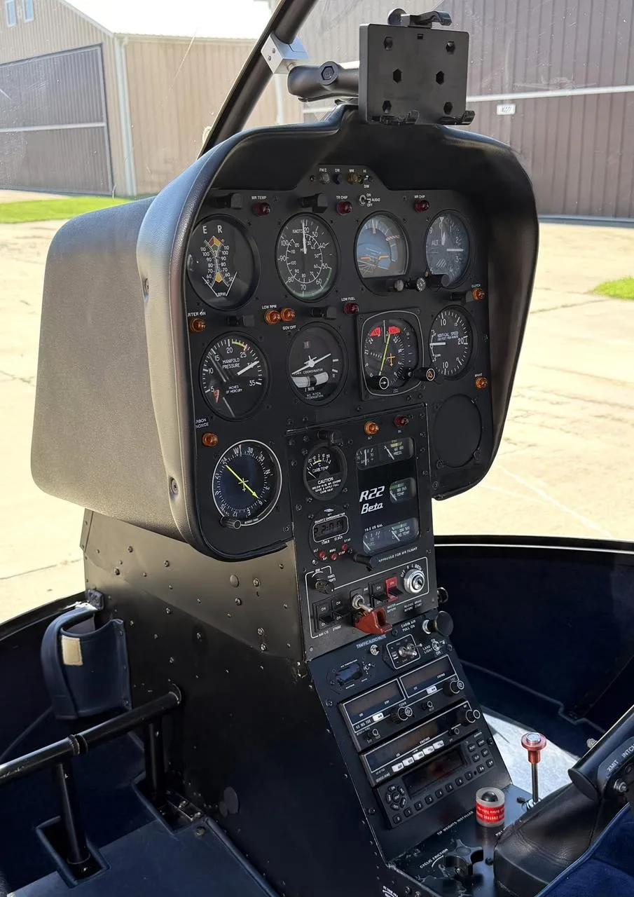 Cockpit and instrument panel of a 1989 ROBINSON R22 BETA.
