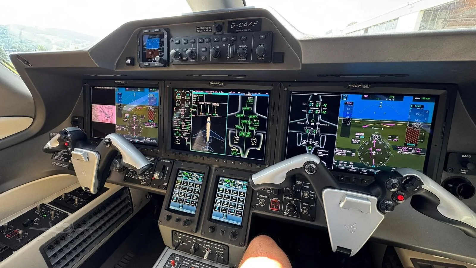 Avionics suite of a 2016 EMBRAER PHENOM 300.