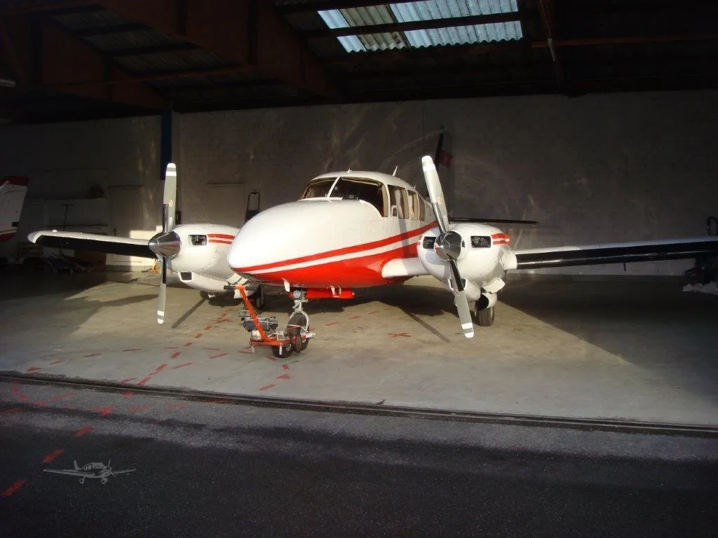 Exterior view of a 1966 PIPER TURBO AZTEC, HB-LDH.